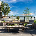 Cozy Terrace Garden With Wooden Table Chairs Green Plants And Gray Floor Tiles
