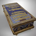 Antique Ornate Decorative Box Featuring Intricate Golden Figure Reliefs On Blue Background