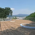 Garden Landscape Wooden Deck Circular Stone Features Railing Trees Distant Mountains City View Clear Sky