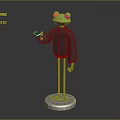 Green Frog Sculpture with Black Clothing Red Eyes and Thumbs Up Gesture on Silver Base