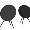 Modern Headphone Speaker with Black Circular Design and Wooden Stand for Home Audio