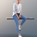 Woman in Grey Sweater and Blue Jeans Sitting on Wooden Platform with Grey Background