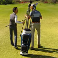 Two Golf Players Preparing Clubs Near Bag On Golf Course