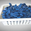 White Plastic Basket Filled With Blue Clothespins For Household Use