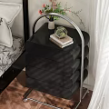 Modern Black Bedside Cabinet with Multiple Curved Drawers and Decorative Vase Books on Top