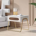 Elegant Modern White Nightstand with Gold Legs Lamp Cup Book Beside Sofa and Plant