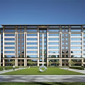 Modern Building Facade With Glass Windows Landscaped Grass Lawn Sculpture And Trees