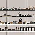 Assorted Tea Sets Including Teapots Teacups and Trays Displayed on White Shelves