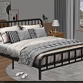 Modern Double Bed with Black Metal Frame Striped Quilt Pillows Bedside Table Lamp and Plant