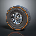 Car Tire And Alloy Wheel Rim With Silver Spoke Design And Orange Accent