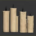 Beige Cylindrical Decorative Candles With Wax Drips On Dark Surface