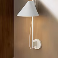 White Minimalist Wall Lamp With Soft Lighting Mounted on Wooden Wall