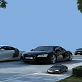 White And Black Luxury Sports Cars Parked On Paved Area With Trees