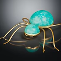 Spider Sculpture With Golden Legs And Turquoise Spheres On Black Background