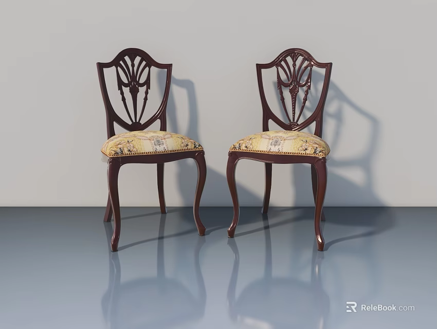Two Elegant Dark Wooden Chairs With Carved Patterns And Floral Fabric Seats 3d model 