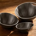Black Dinnerware Set with Three Different Sizes Bowls with Handles on Wooden Table