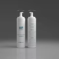 White Cosmetic Spray Bottles With Skincare Product Labels On Gray Background