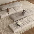 Beige Modular Sofa Set With Cushions On Woven Rug And Book