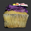 Delicious Cupcake With Purple Frosting And Rainbow Decoration On Black Background
