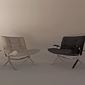 Modern Beige Tufted Lounge Chair With Metal Frame And Black Side Table On Wooden Floor
