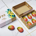 Fresh Mangoes In Pink Box With Mango Pattern And Brown Paper Container