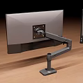 Different Design Monitor Arms With Red White And Silver Colors On Wooden Floor