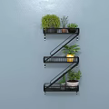 Z Shaped Metal Wall Cabinet Mounted On Gray Wall With Green Plants And Yellow Container