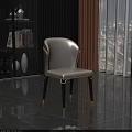 Modern White Leather Dining Chair With Curved Backrest Black Legs Golden Accents