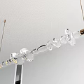 Modern Transparent Glass Linear Chandelier Hanging From Ceiling With Metal Ends