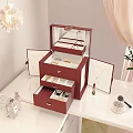 Elegant Red Jewelry Organizer Set With Mirror Drawers Cosmetics And Pink Rose Vase On Desktop