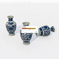 Traditional Blue and White Ceramic Vases with Intricate Floral Patterns Standing and Lying