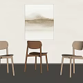 Minimalist Modern Dining Chairs in Light and Dark Wood Tones Against Light Wall with Abstract Painting