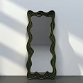 Wavy Frame Mirror With Green And Black Stripes Against White Wall And Gray Floor