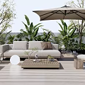 Comfortable Beige Outdoor Sofa on Wooden Deck With Large Umbrella Coffee Table And Green Plants