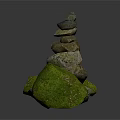 Artistic Balanced Stacked Stones Structure With Natural Green Moss Covered Rocks