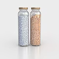Two Glass Spice Jars With Gold Lids Filled With White And Brown Spices On Surface