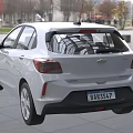 White Chevrolet Compact Car With Modern Exterior Design And Sleek Body Lines
