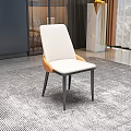 Modern Dining Chair With White Upholstered Seat Back And Black Metal Legs In Contemporary Interior