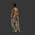 Woman in Strapless Beige Layered Dress with Red Accents White High Heels on Gray Background