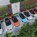 Colorful Electric Cars Parked Alongside Modern High Rise Buildings With Green Plants