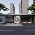 Modern Entrance Gate with Glass Structure Canopy Surrounded by Tall Buildings and Trees Fronting Driveway