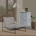 Modern Light Gray Chaise Lounge With Black Metal Frame By Window Blinds And Marble Drawers