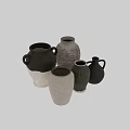 Various Ceramic Vessels In Green White Brown With Handles And Textured Striped Designs