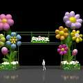 Vibrant Illuminated Event Gateway With Colorful Flower Decorations And Green Base
