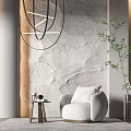 Light Gray Round Armchair With Side Table Decorative Items And Textured Wall 3d model