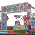 Vibrant Event Entrance Featuring Red And White Checkered Tents On Grass With Pink Flower Decorations