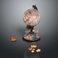 Decorative Ornament Set Featuring Globe With Ornate Base And Maple Leaves Accents