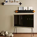 Modern Television on Black Tripod Stand with Wall Shelf and Orange Accents