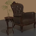 Antique Leather Armchair With Carved Details And Wooden Side Table With Green Plant