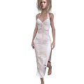 A woman wearing elegant ivory halter neck satin dress walking gracefully with side slit